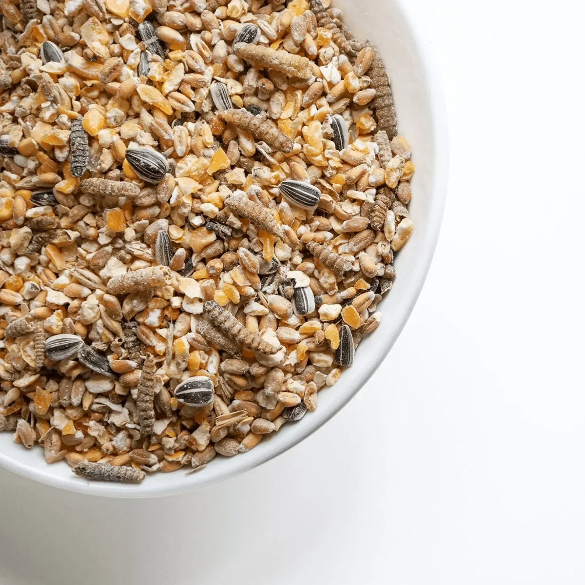 Komplete voedzame Smulmix kippensnack met Nutri Worms, zaden en granen voor gezonde, blije kippen en natuurlijk scharrelgedrag.